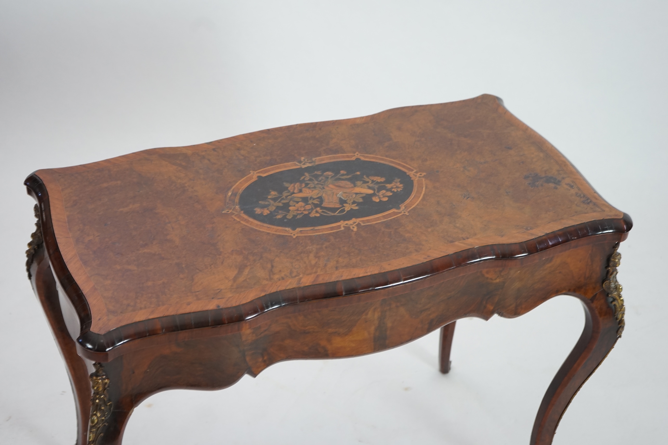 A Victorian marquetry inlaid burr walnut card table